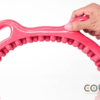 Hot pink half-moon shaped wooden waist massager with multiple fingers and two handles for easy gripping.