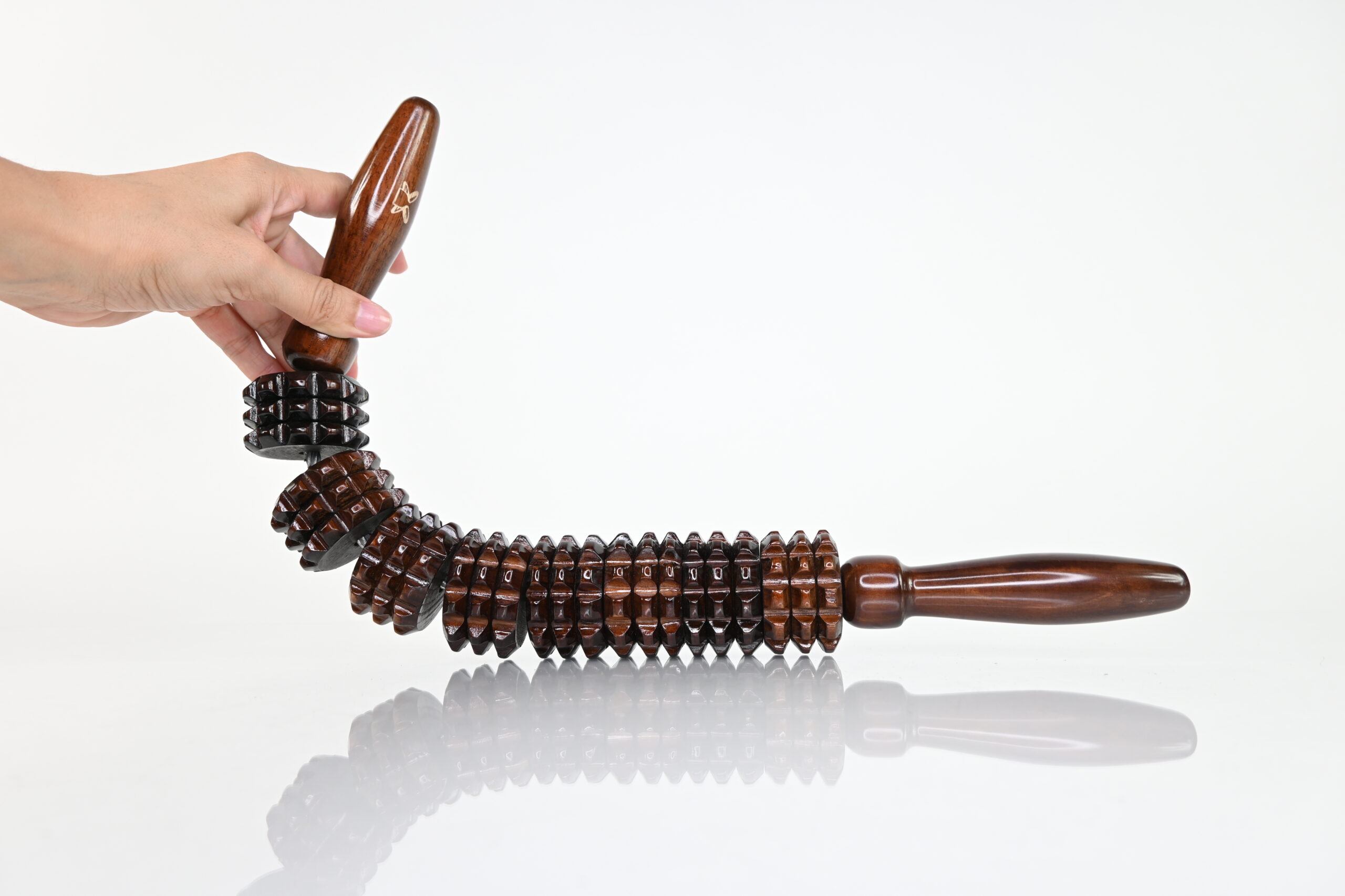 Flexible diamond massage roller bending to show body adaptability