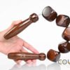 Wooden Massage Rollers with five dark brown cubes, designed for flexible and effective body massage and fascia release.