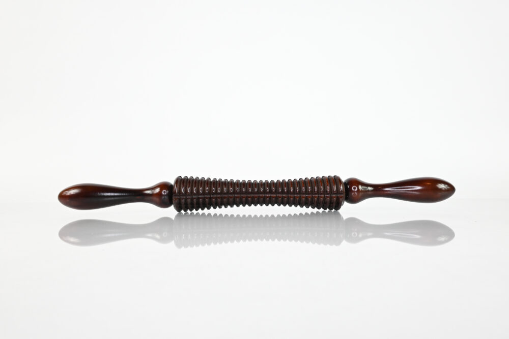 Full view of textured wooden cellulite massage roller