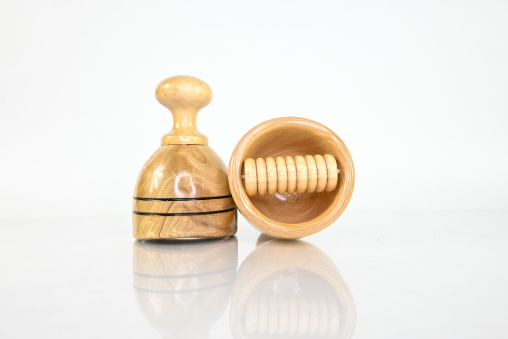 Swedish wood cup beside wood therapy cup with soft internal roller