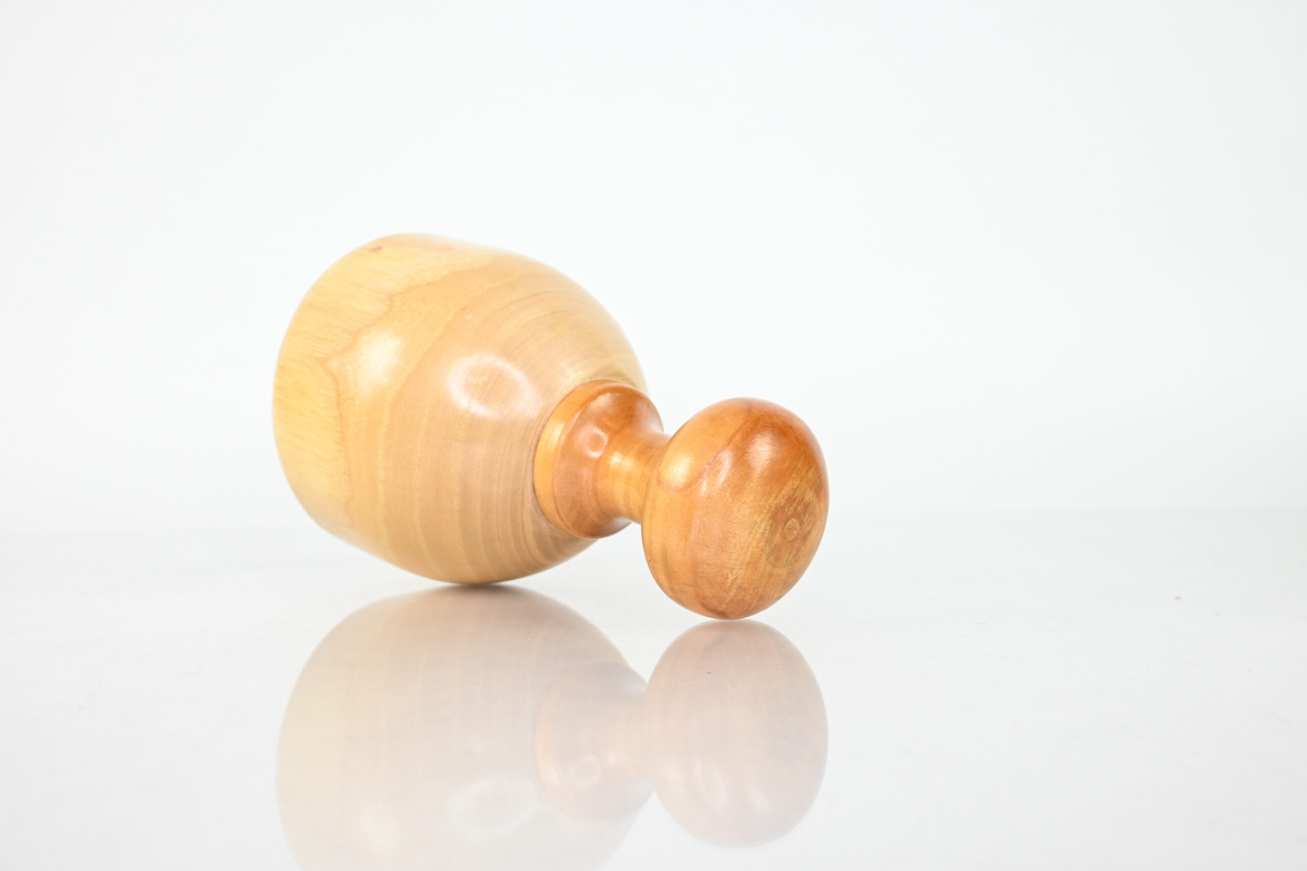 Interior of Swedish wood cup beside soft roller cup